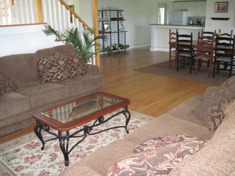 Lovely hardwood floors compliment the open and spacious living room/dining room.