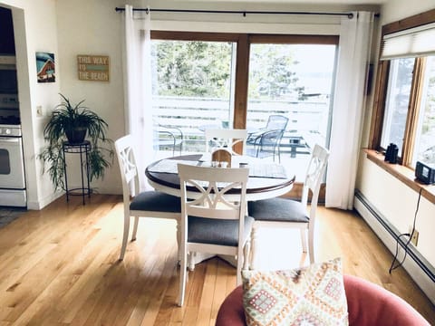 Dining area with view through sliding glass doors to porch