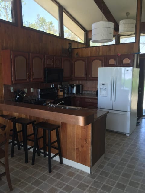 Kitchen area with bar seating