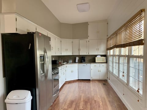 The kitchen has fresh paint and new lighting as of March 2021.