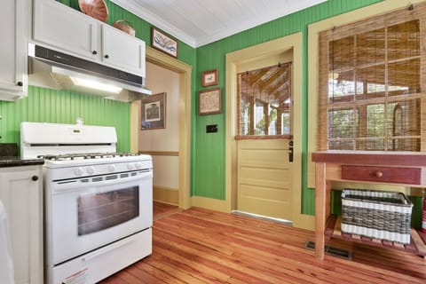 Kitchen with entrance to screened in porch. 