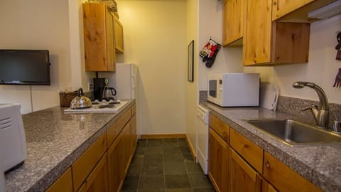 Kitchen with granite tops, fridge, freezer, dishwasher cooktop and convection 