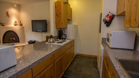 Kitchen with granite tops, fridge, freezer, dishwasher cooktop and convection 