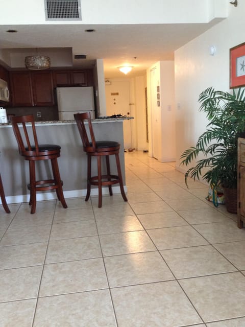 Main entrance and kitchen with bar area.