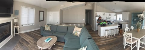 Panoramic of renovated flooring, kitchen and family room