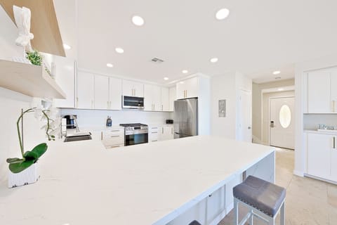 Kitchen with beautiful quartz countertops and stainless steel appliances