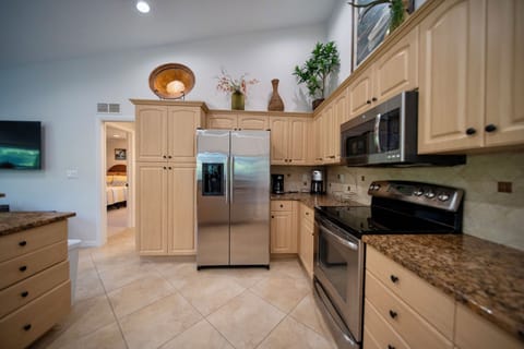 Modern kitchen and appliances with stone counters