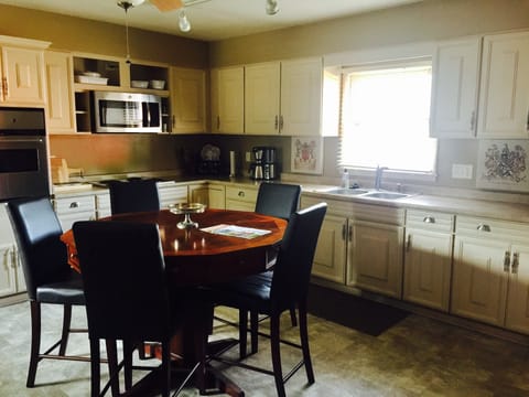 Kitchen table with built in drawers, filled with family games! 
