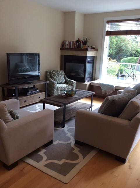 Living room w/ furniture from Urban Barn and window seat cushion for relaxation
