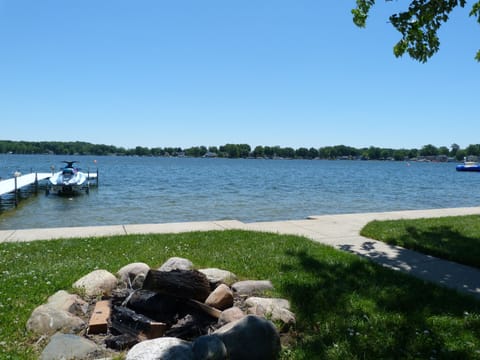 Large lake side fire pit with lake view