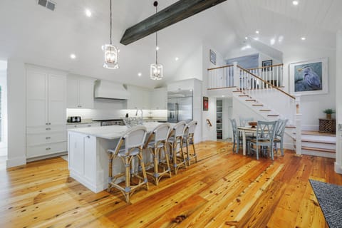 Kitchen Island Seats 4 and Adjacent Breakfast Table Seating 4