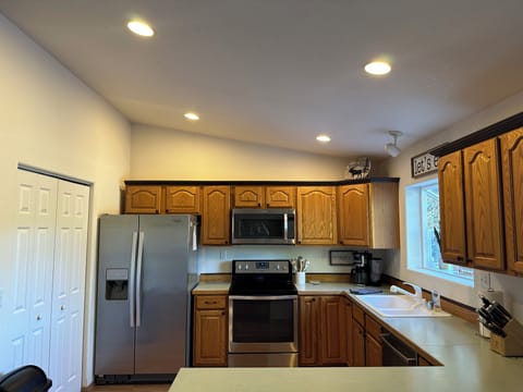 Well stocked kitchen with updated stainless appliances.