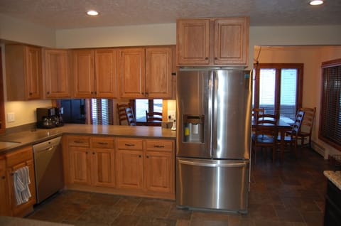 Kitchen with slate flooring and Corian counter tops.