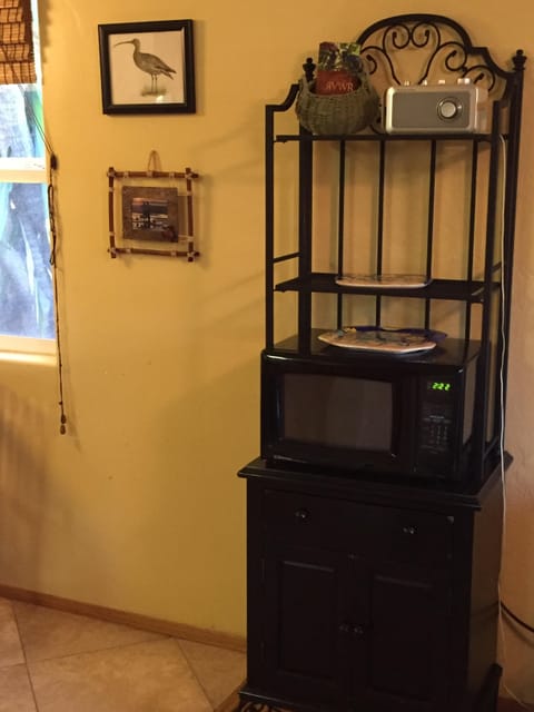 MIcrowave shelving unit. Stores for trays and extra items.
