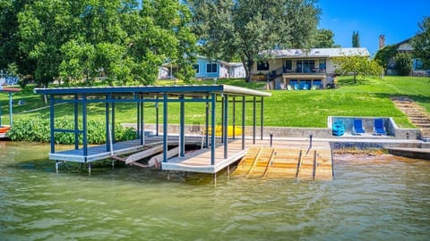 Dock with boat lift and two jet ski ramps. Three kayaks available.