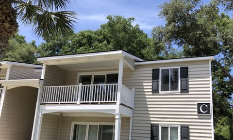 C4 private, covered balcony with dining table and chairs. Lighted for night use.