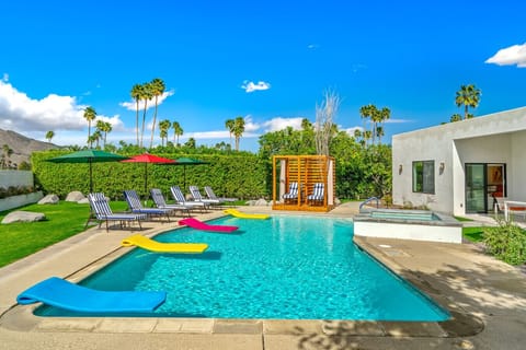 Private desert resort pool with cabanas and San Jacinto Mountains backdrop