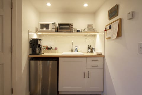 Kitchenette with utility sink.