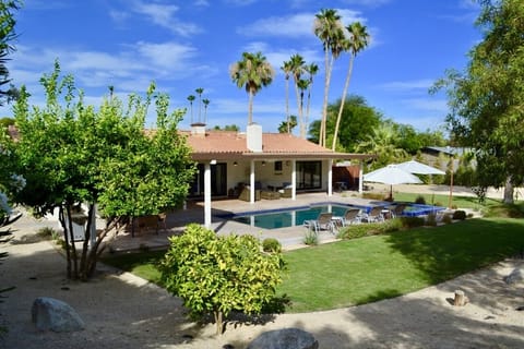 The house is situated on a half acre corner lot with a large backyard.