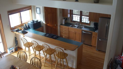 Stainless appliances including gas stove in kitchen.