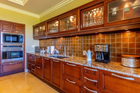 Fully stocked kitchen featuring modern appliances and warm wood cabinetry