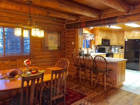 Dining area, eating bar, and kitchen.