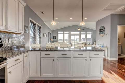 You can see the entire upstairs from the kitchen.  The bar sits four more.