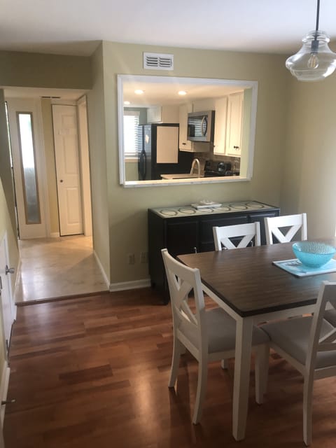 View from living area to kitchen and walking out front door