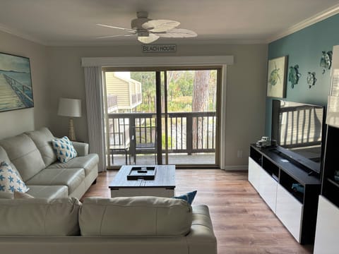 Living Room with ceiling fan and comfortable sofas
