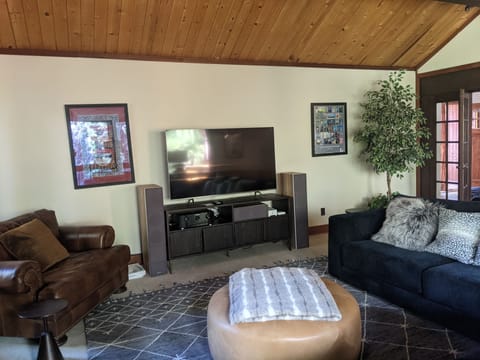 Spacious living room, with workspace, high end surround sound, sonos, large TV