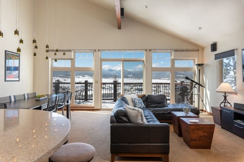 Main floor with large open plan living/dining and kitchen area and porch.