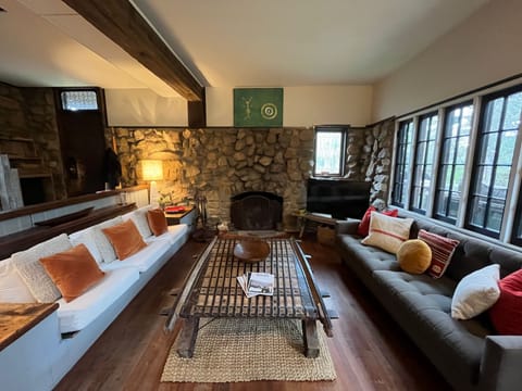 Living room with wall of windows to the outdoors