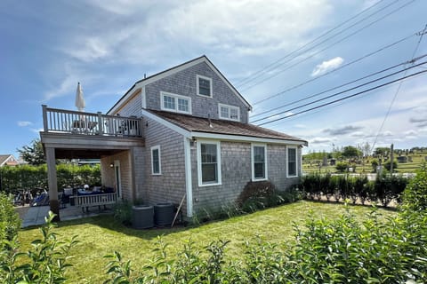 Private side yard, expansive upper deck, covered porch with porch swing