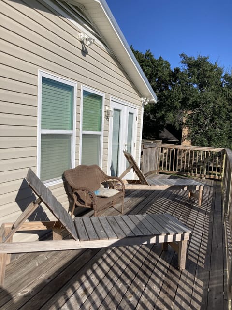 Upstairs deck with lounge chairs