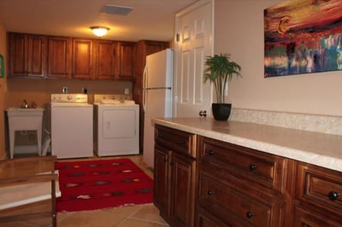 Lower level Utility Room with washer, dryer and refrigerator ...