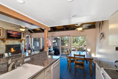 Dining area seats 6 plus 3 at granite bar