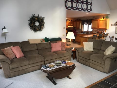 Living area with comfortable recliner seating couches