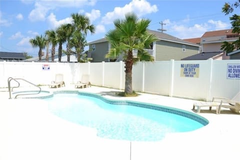 The pool and sundeck create a beautiful tropical setting.