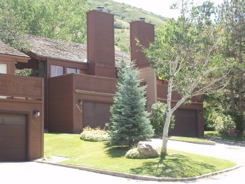 Front of units showing 2-car garage and driveway parking.