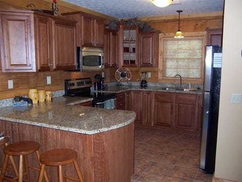 Gourmet kitchen with stainless steel appliances and granite countertops