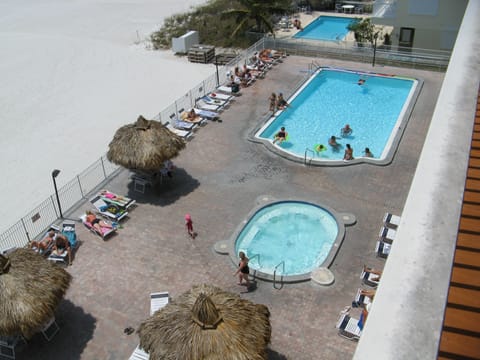 Pool & hot tub beach front with Tiki huts