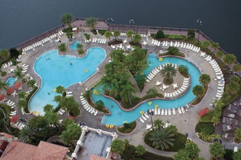 Aerial view of one of the pools, lazy river and lake