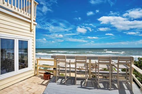 Enjoy your favorite beverage at the bar rail deck overlooking the beach.