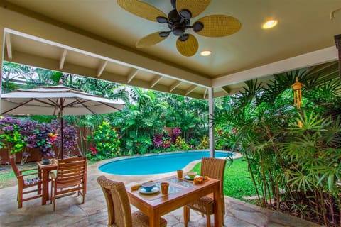 Lush backyard with pool and patio