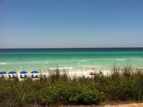 Access to beach directly across street, white sand, clear turquoise-blue water 