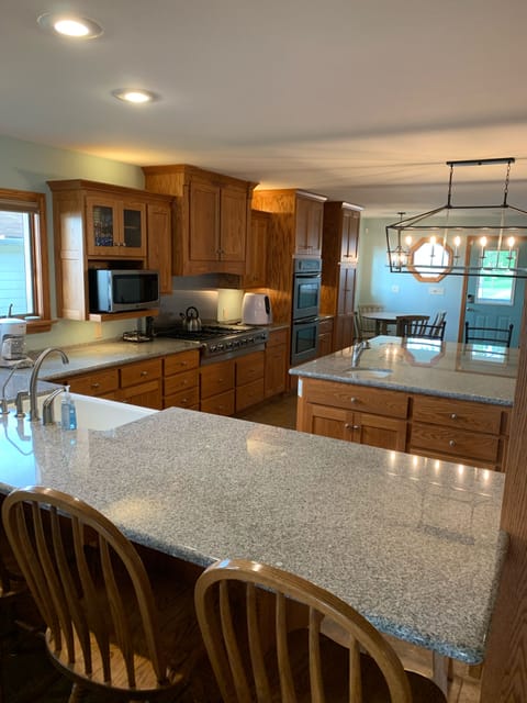 Granite Countertops,  Island is 7'x7' with 6 bar stools and counter also has 4 