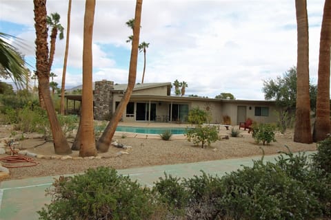 Looking at the rear of our house with pool and shuffleboard court