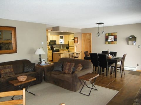 Living room with view of dining room and kitchen