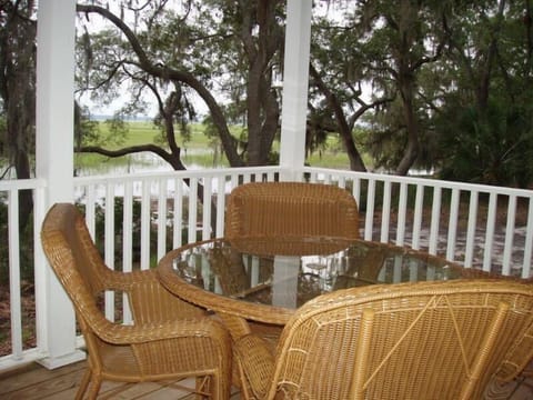 Back porch with 2 tables and chairs for outdoor dining or happy hours