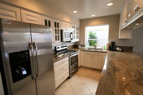 Kitchen has all stainless steel appliances and plenty of cabinet & counter space